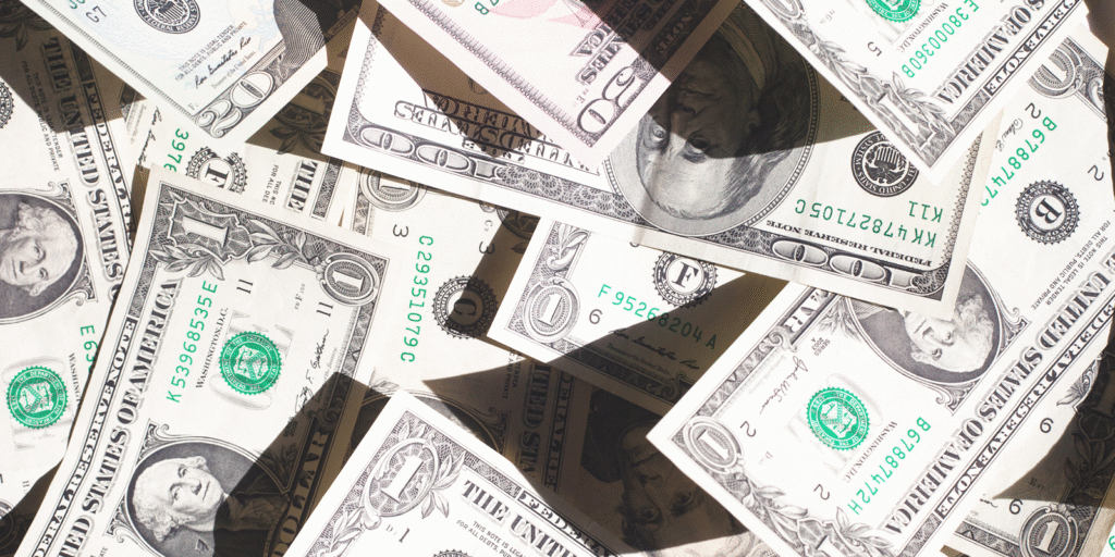 Pile of scattered US dollar bills