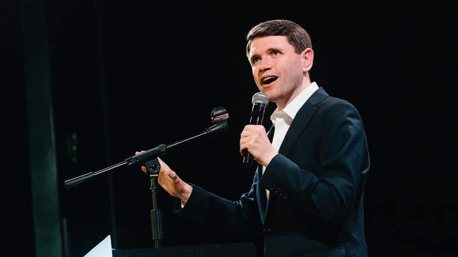 James Talarico speaking into a microphone